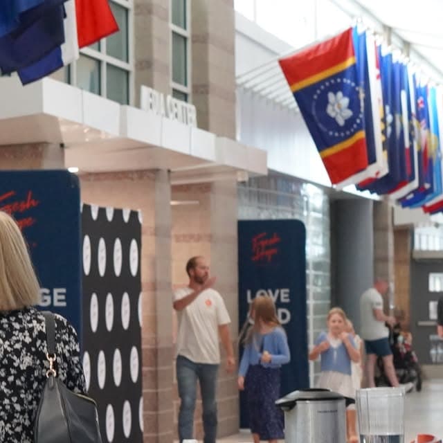 People connecting in the Fresh Hope lobby after a Sunday gathering.